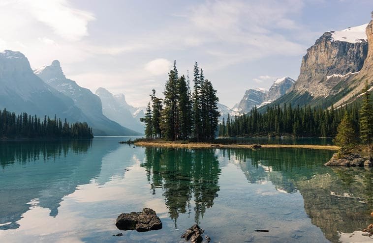 Cruising- Maligne -Lake Vibrant- Blue- Waters -and- Towering -Peaks