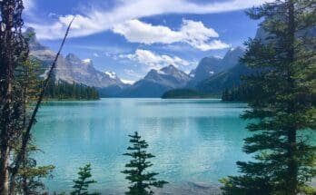 Cruising- Maligne -Lake Vibrant- Blue- Waters -and- Towering -Peaks